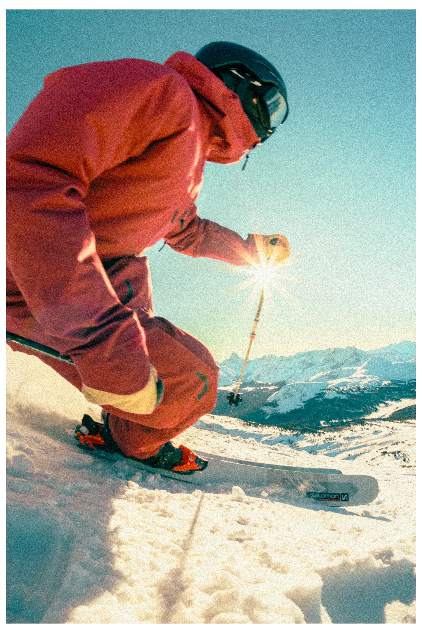 A skier carving close to the snow