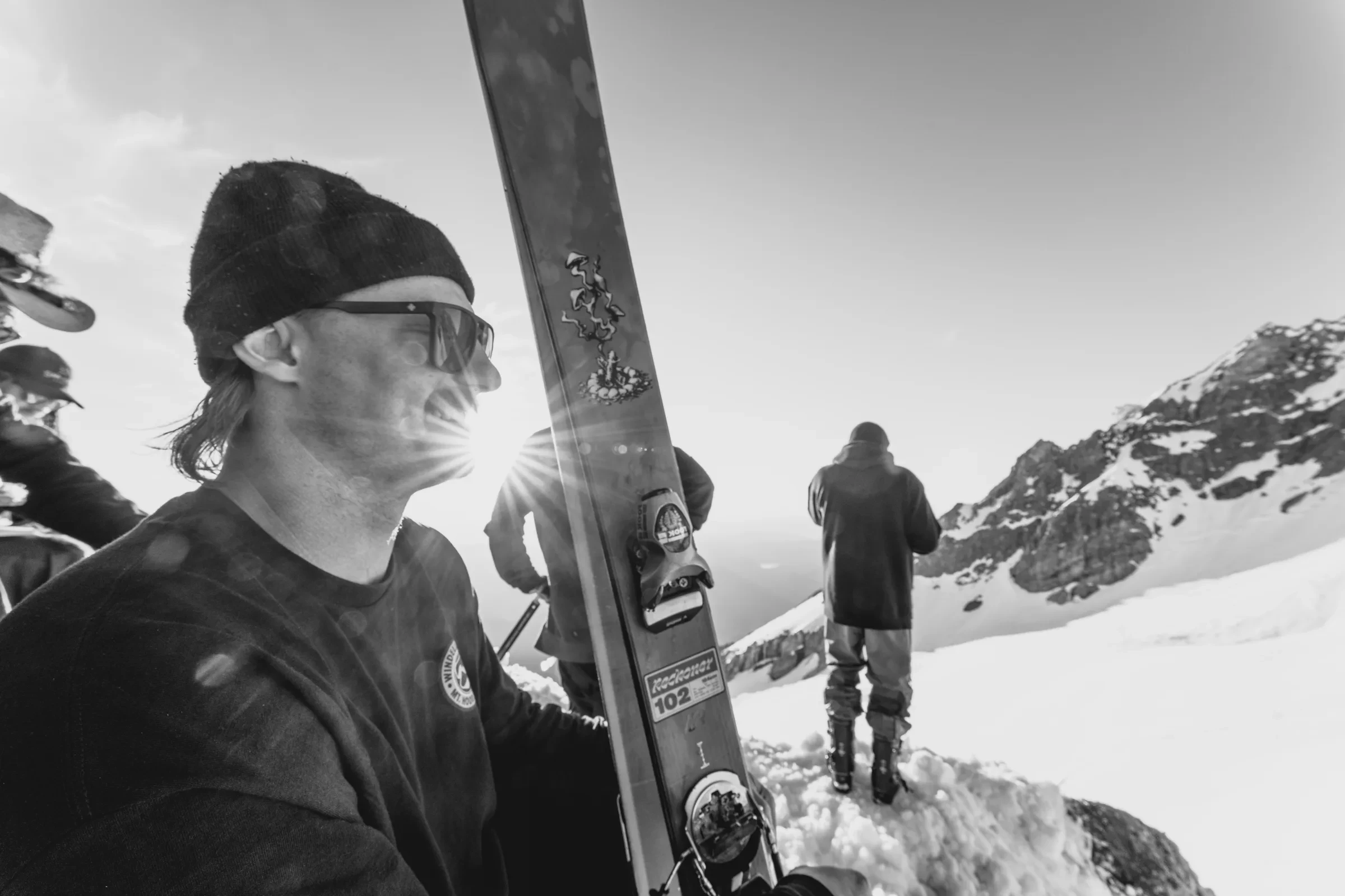 A skier standing on a high ridge