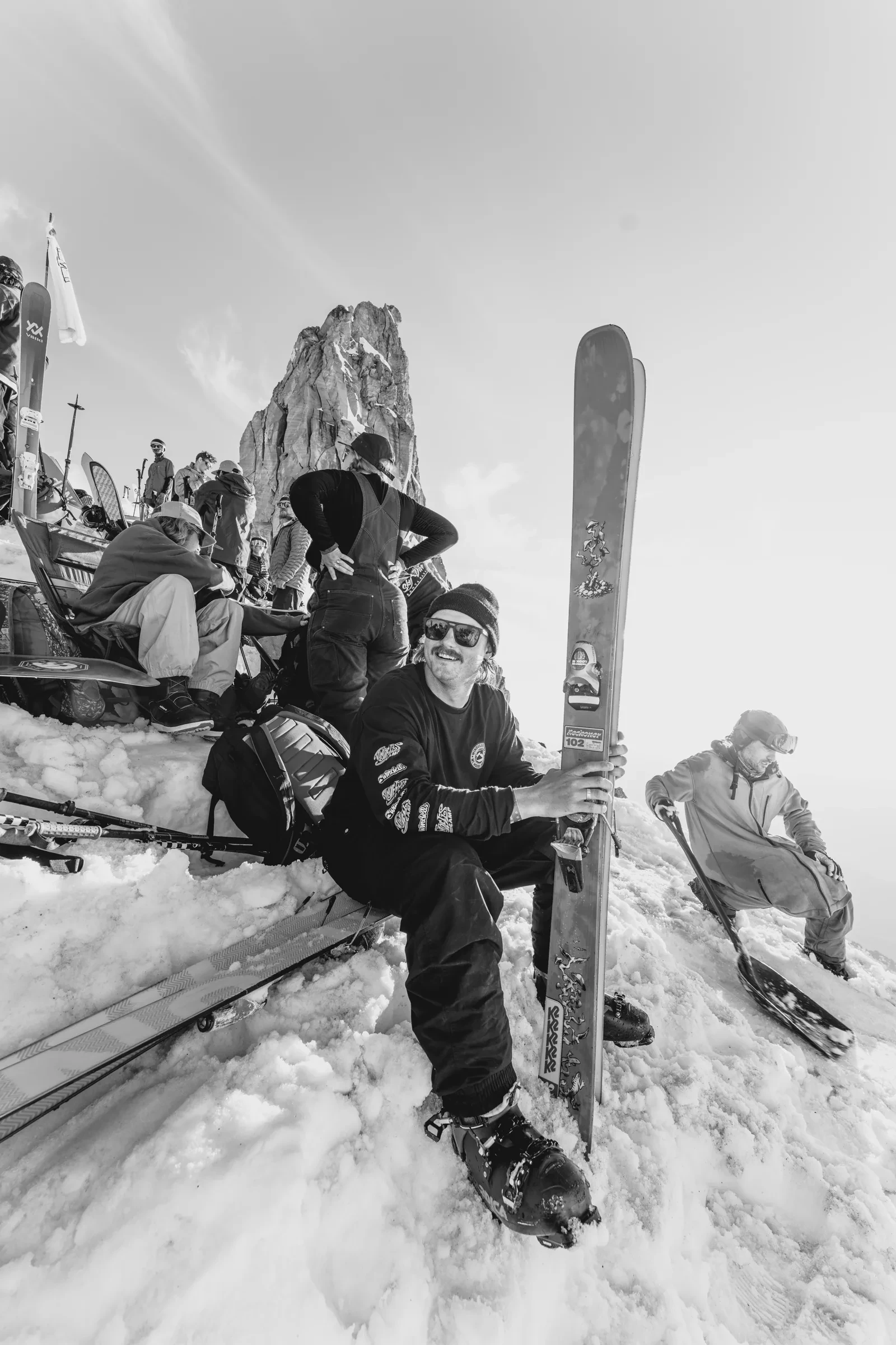 A person resting on the snow during the ascent