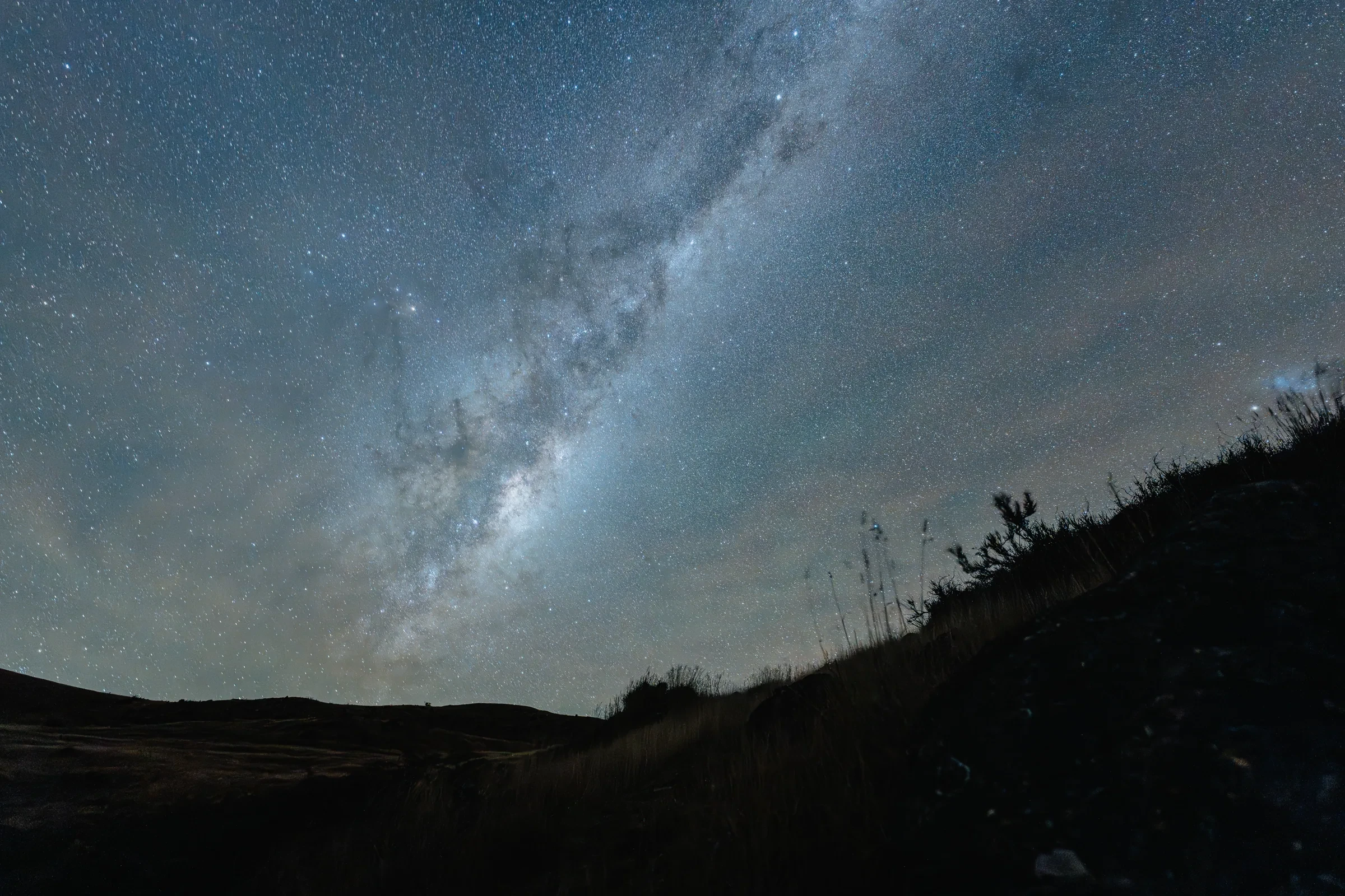 The Milky Way above a dark New Zealand landscape