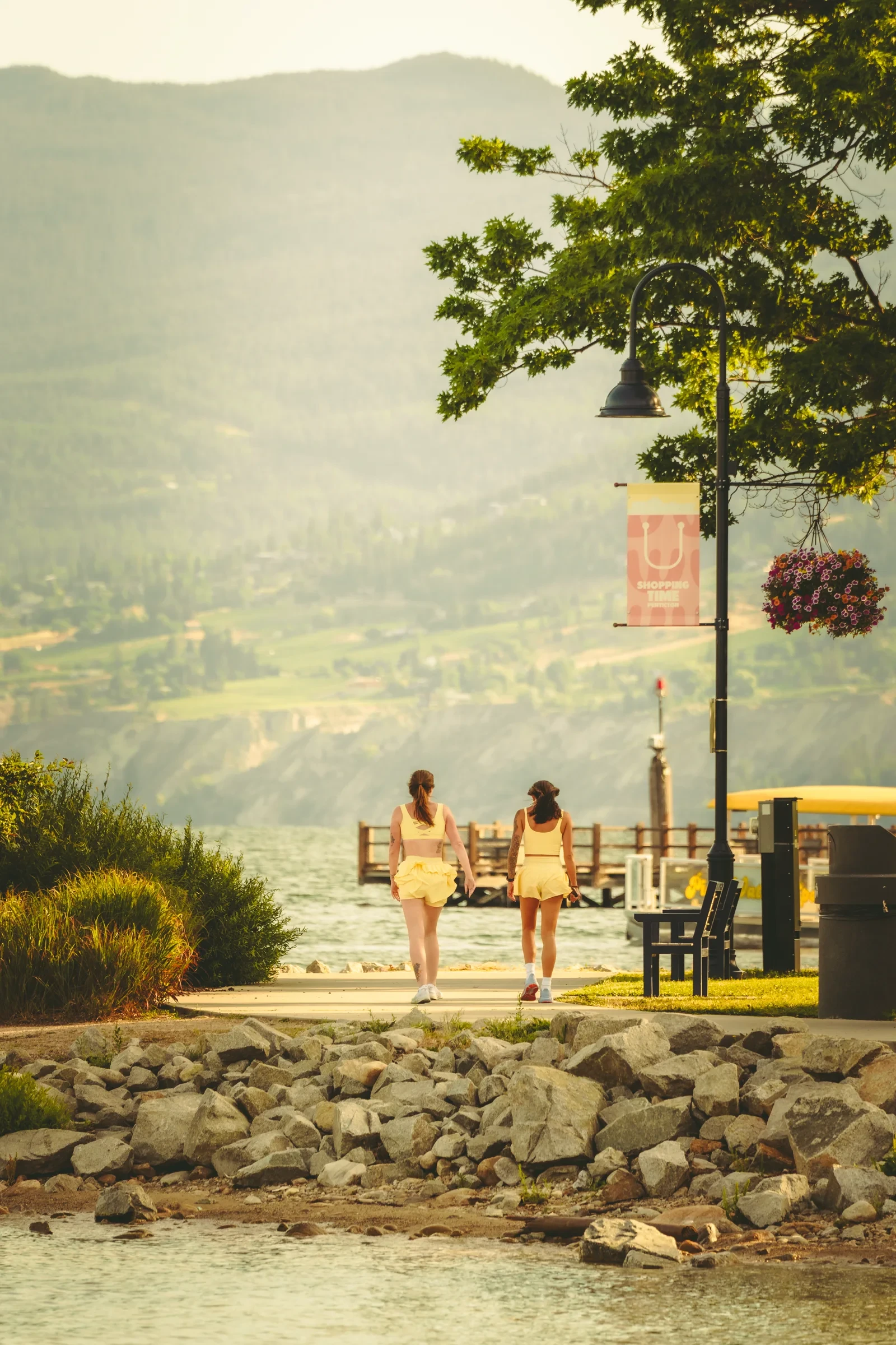 Two runners walking beside Okanagan Lake in Penticton