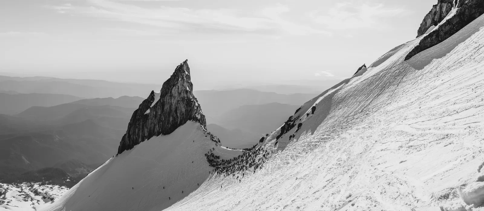 A sharp alpine rock formation in black and white