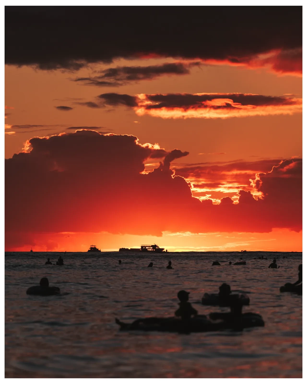 A red sunset settling over the ocean