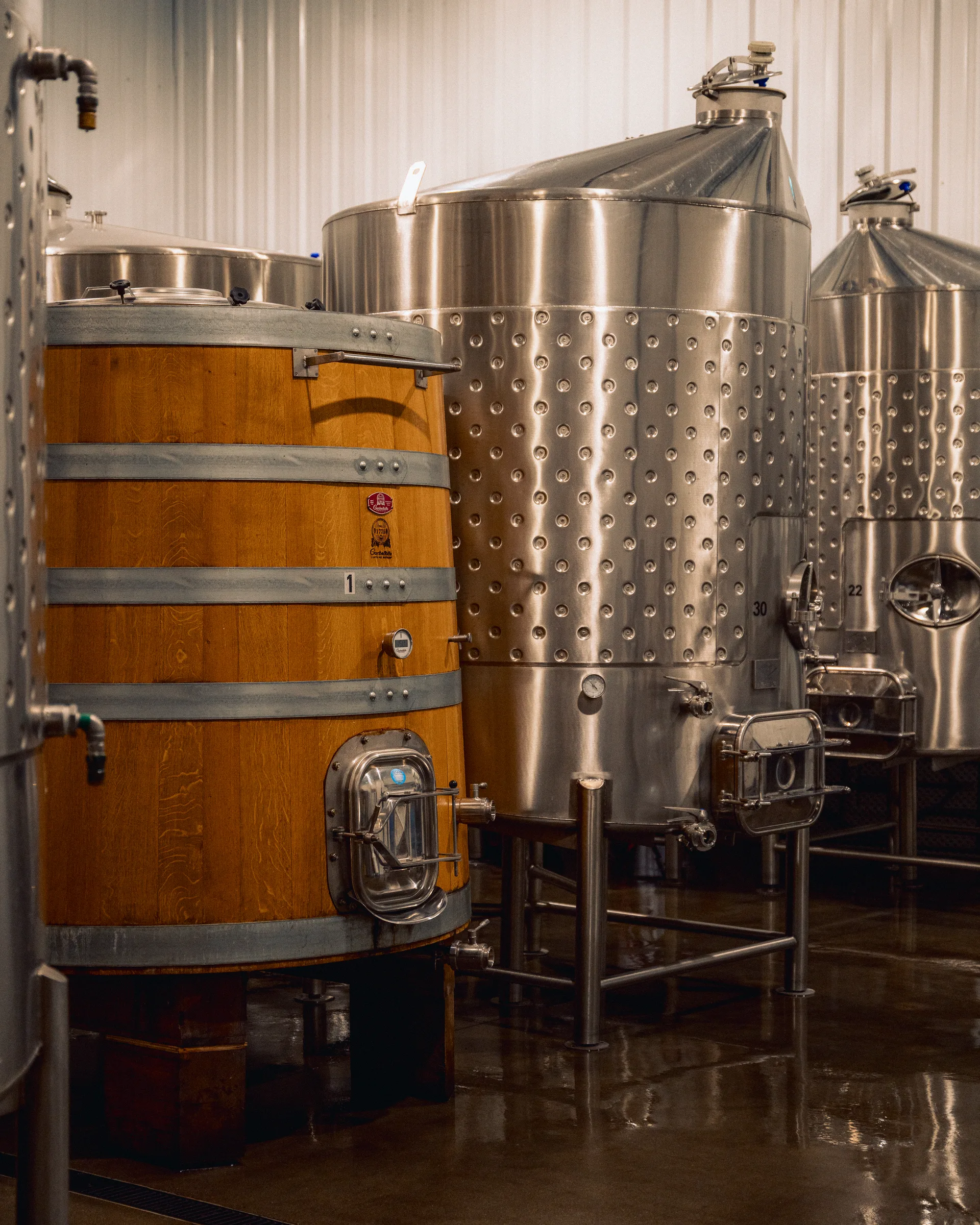 Stainless steel and wooden vessels inside the winery