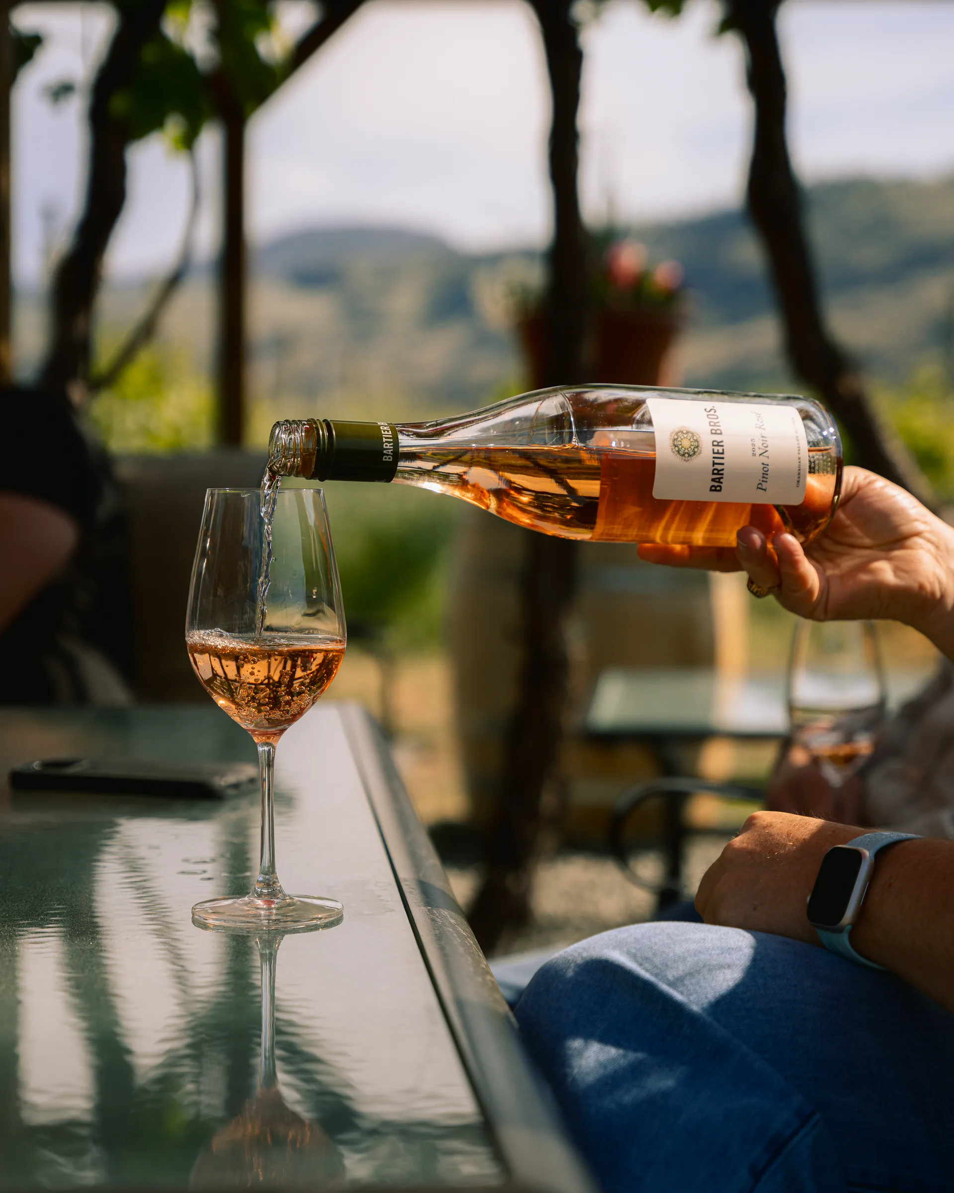Rosé being poured into a wine glass