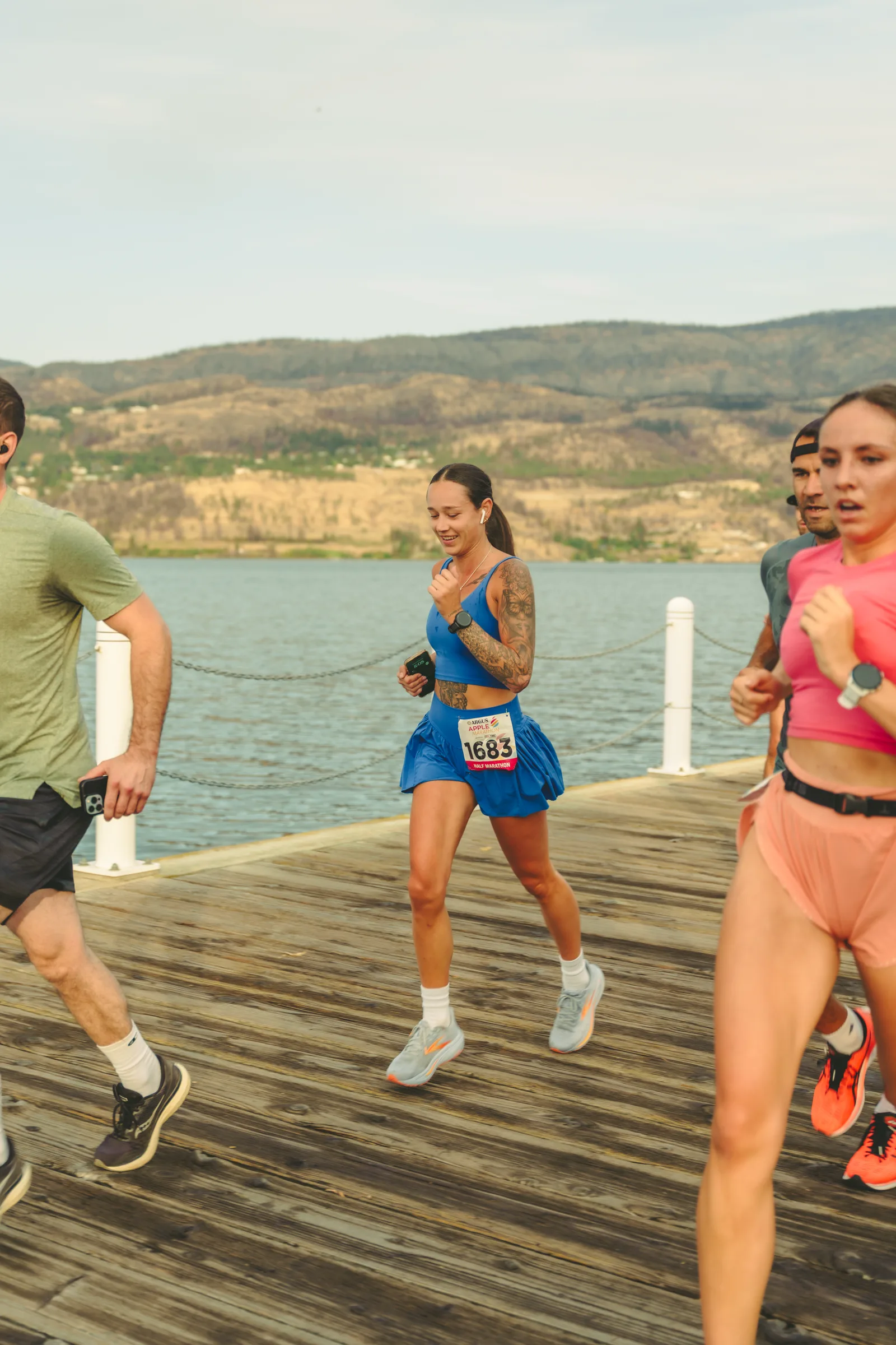 A runner moving along the lakeside course