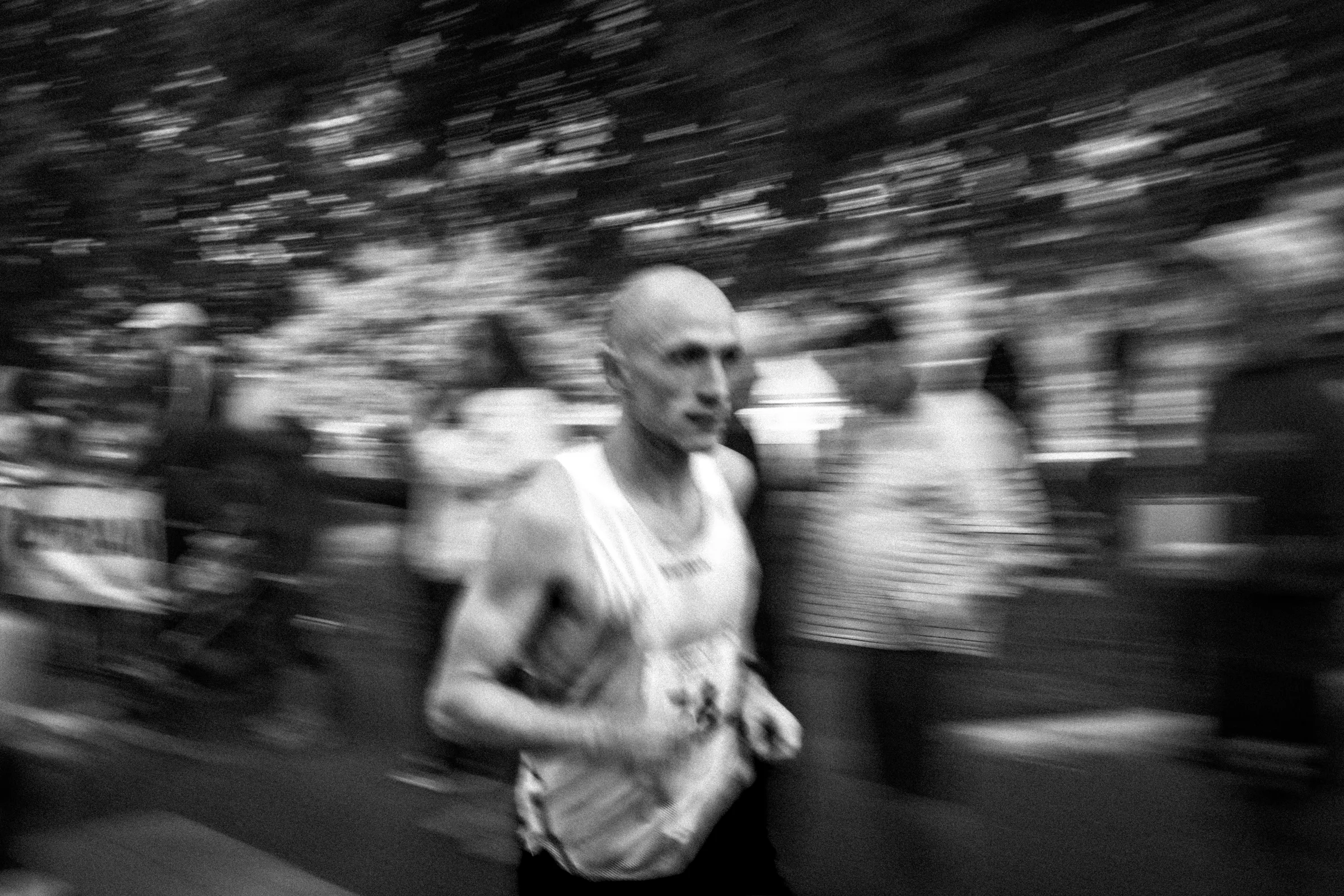 A runner moving through a black-and-white motion study