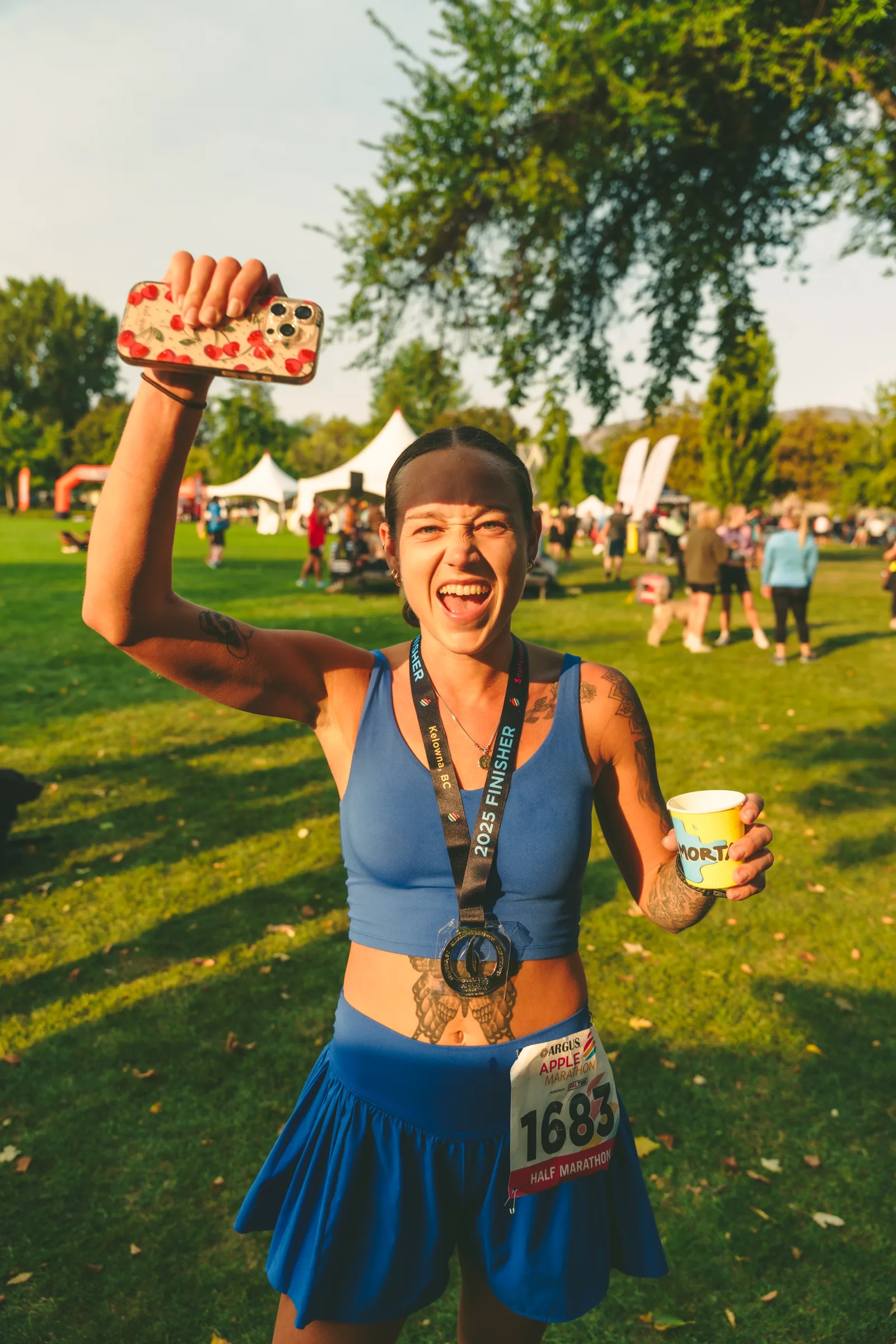 A participant holding a medal after the race