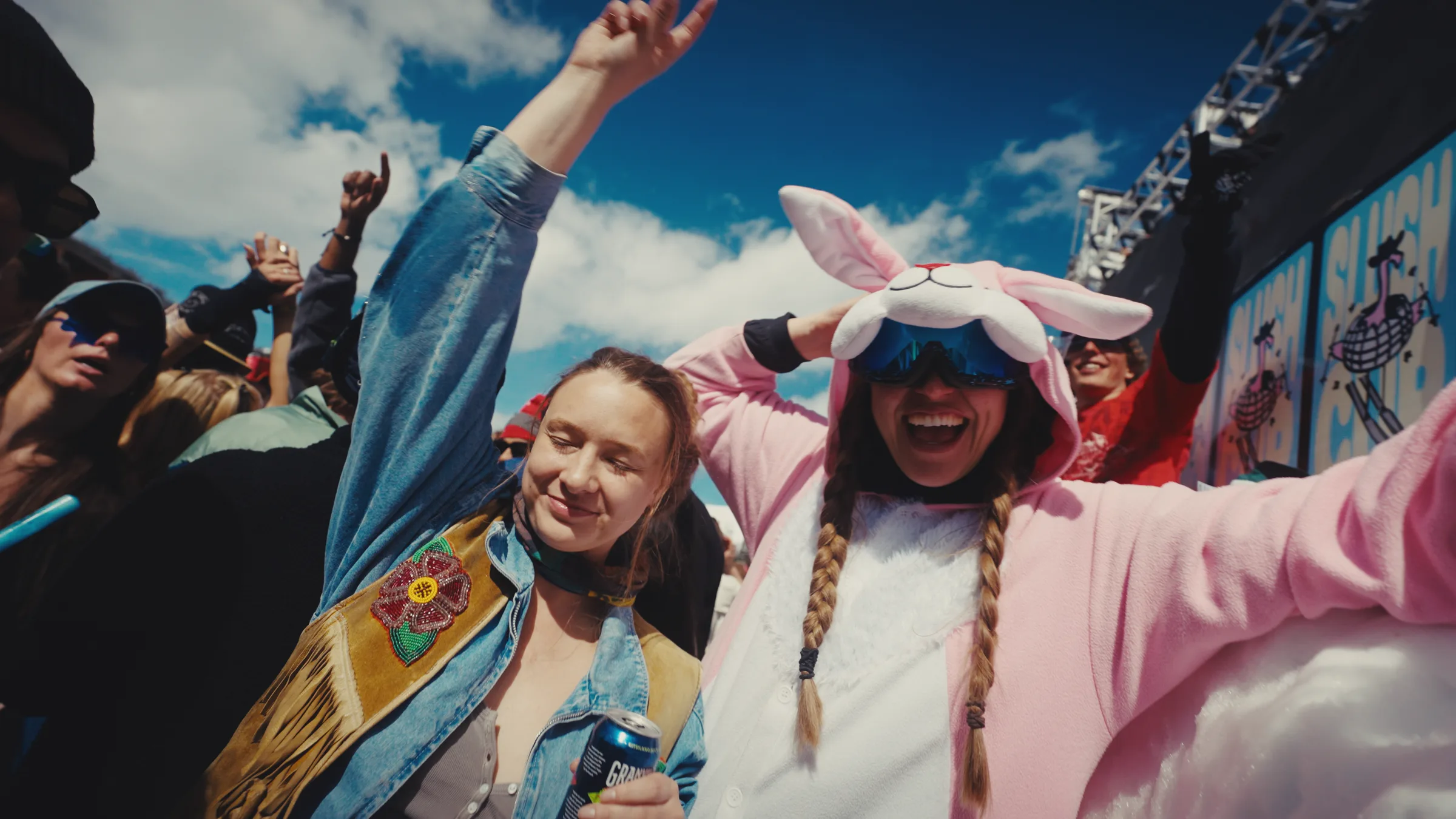 Costumed spectators dancing beside the Slush Cup stage