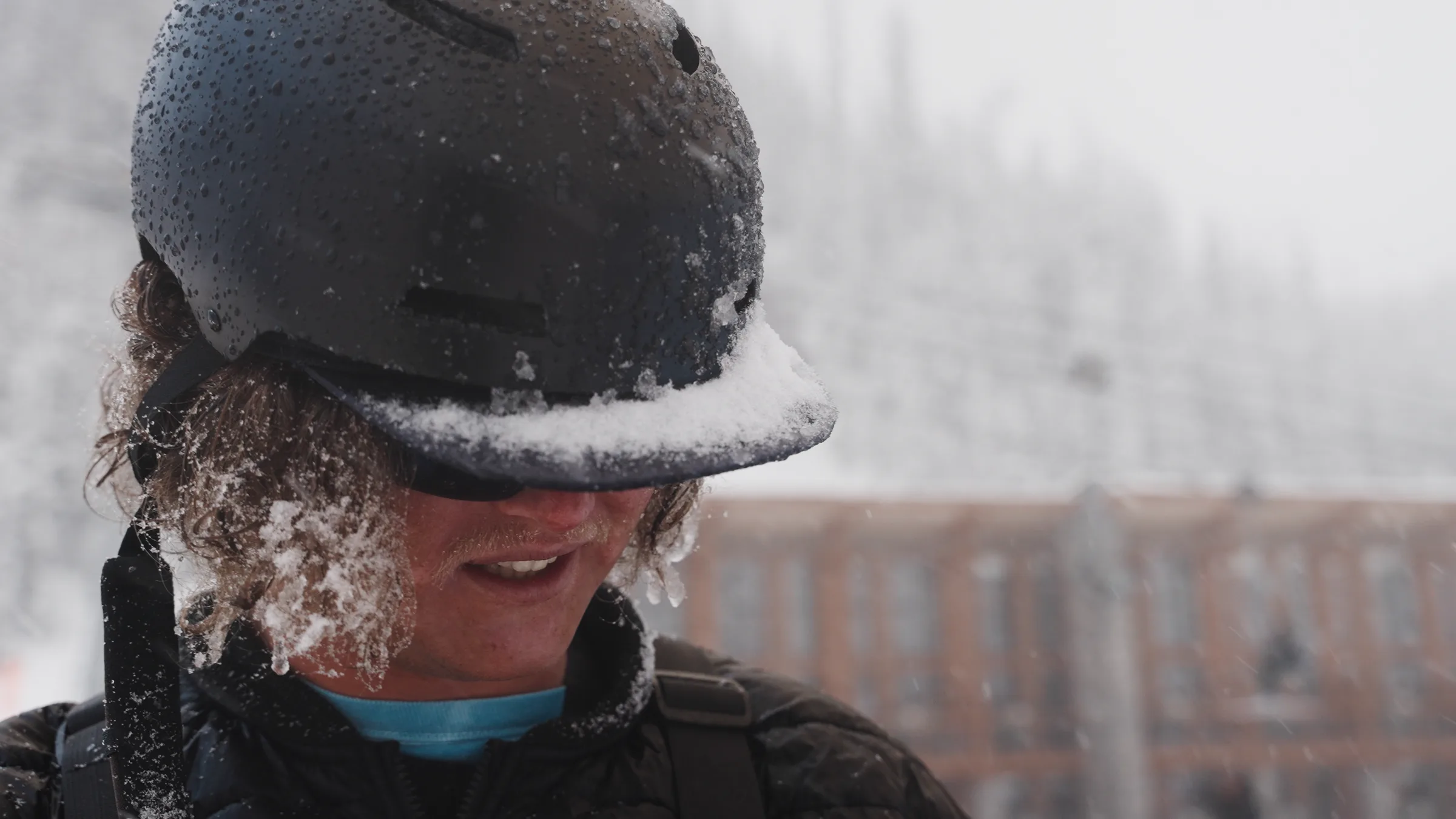 A participant covered in fresh snow