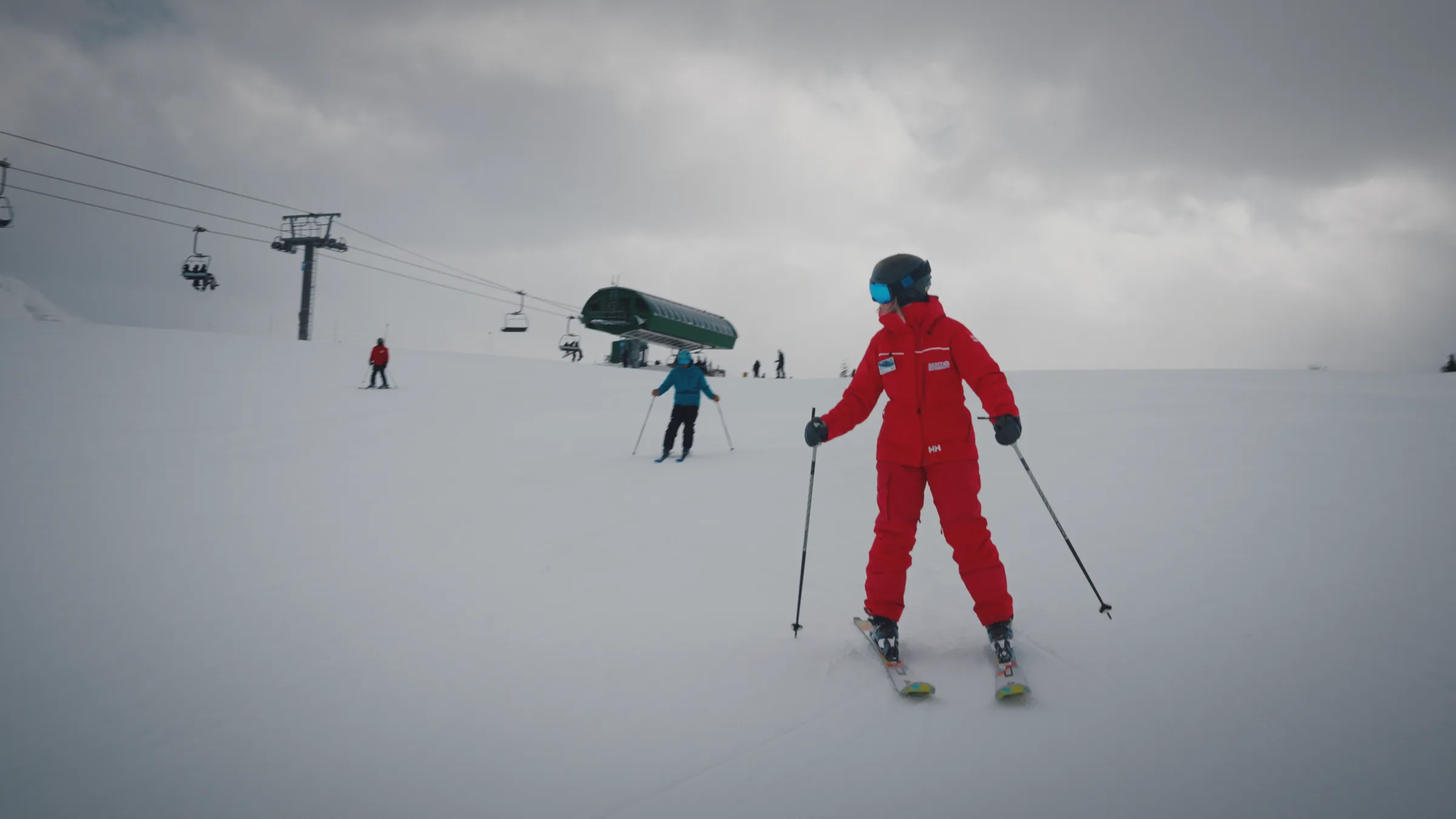 A ski instructor leading a group on the mountain